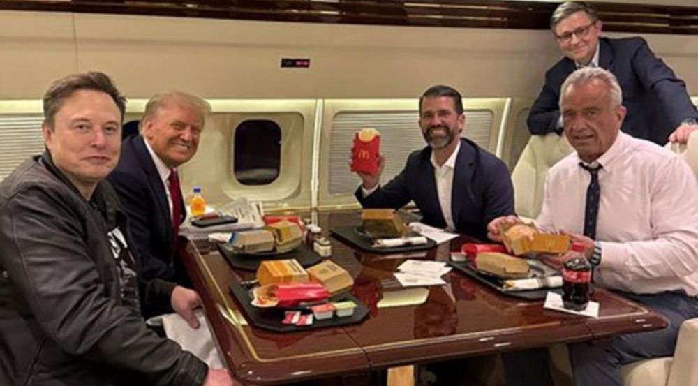 Donald Trump, Elon Musk, RFKJr, Donald Trump Jr and Michael Johnson eating McDonalds on Trump’s plane. 