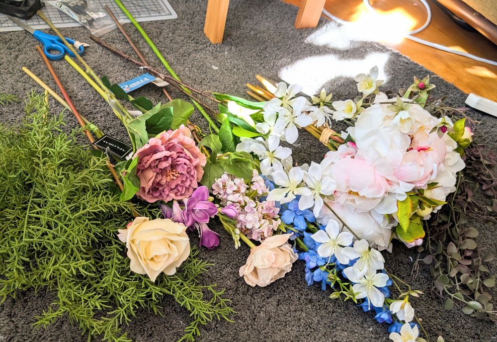 An assortment of faux flowers for use on my fursuit antlers.