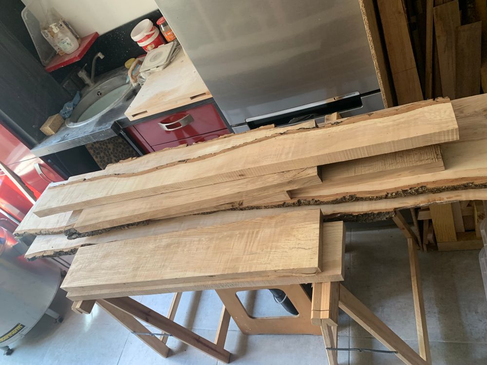 A stack of jointed ash planks ready for thicknessing
