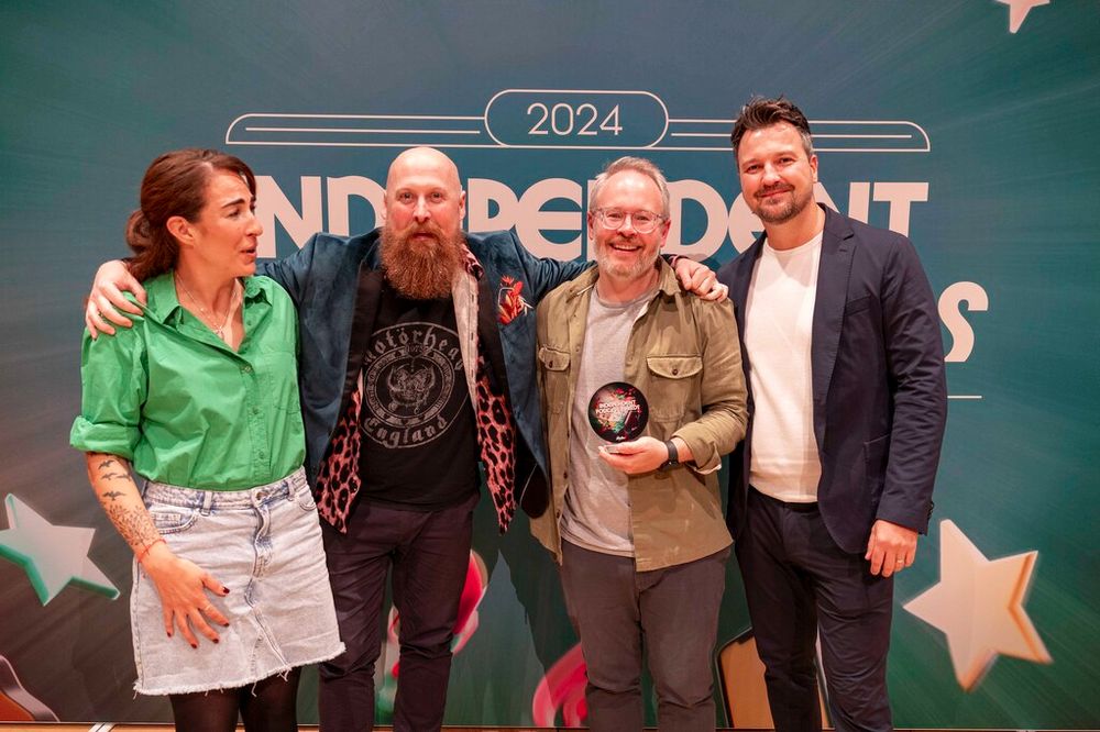 Damien and Ant pose with award host and awards presenter