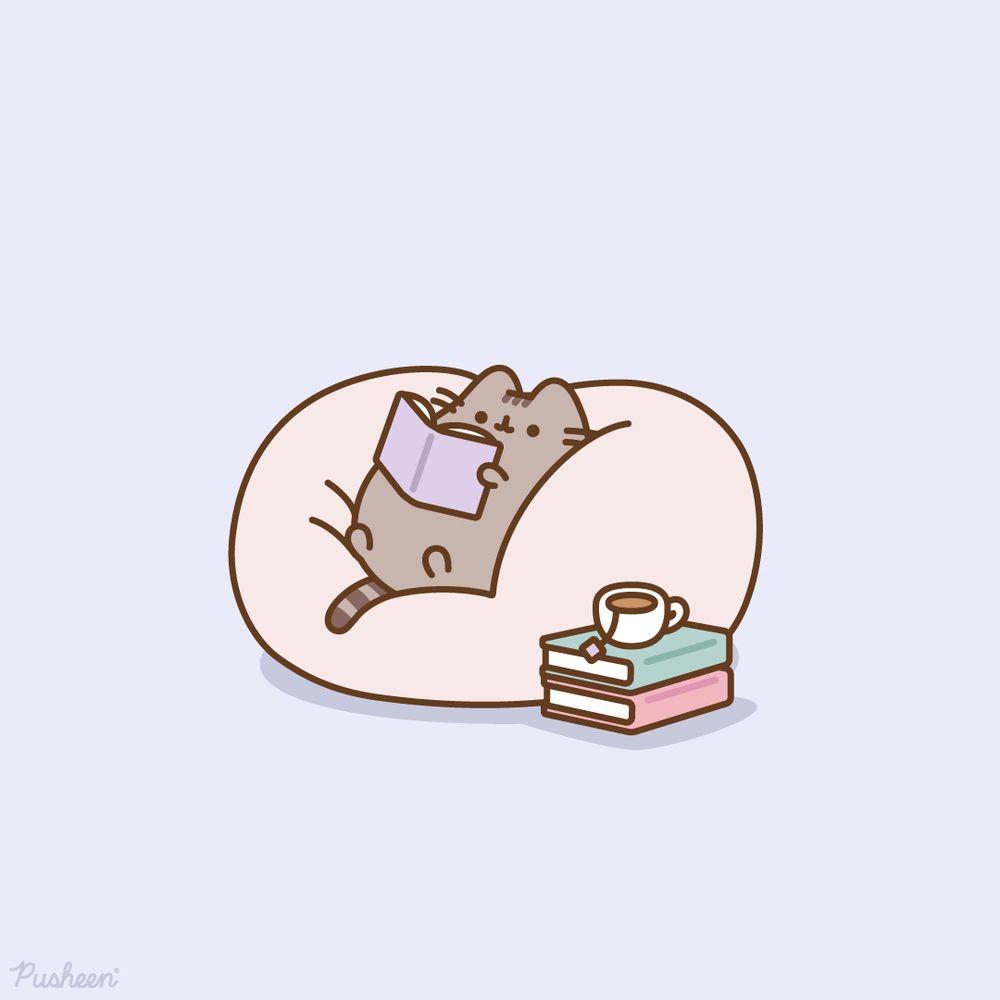 Pusheen reads a book while comfy in a bean bag chair.