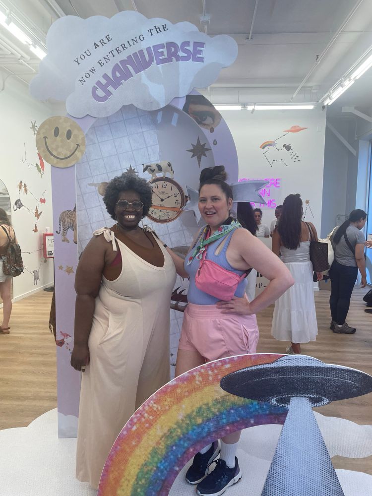 Shalewa Mackall on the left, miss al boogie in the right in front of an astrology pop up