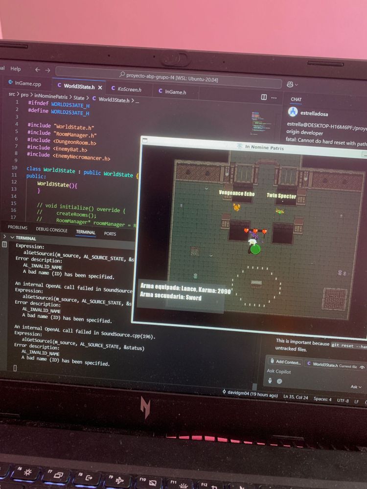 An image of a screen laptop in which there is a window of a code editor full of C++ code and another window named "In Nomine Patris" showing a frame of a videogame.