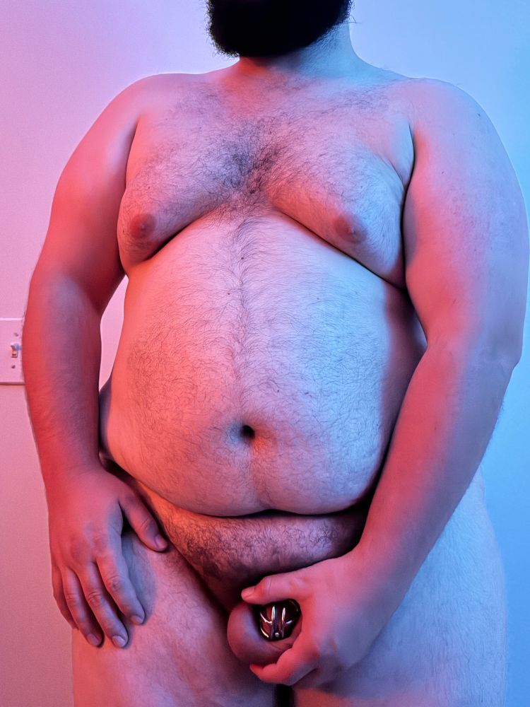 Me holding my cock locked in my new badassworkroom cage with an integrated pa hook.