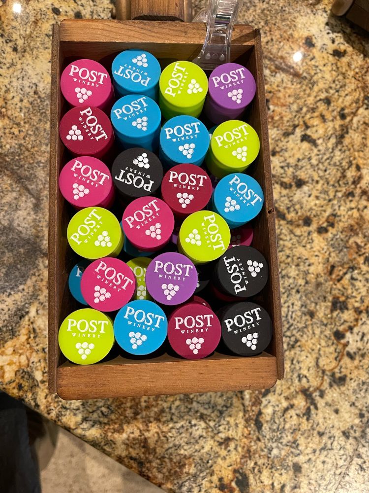 in time for patio season...Post retail store has brightly tinted silicon wine caps that go over most opened wine bottles, whether cork or twistcap finish. (keeps the fruity aromas in and those pesky gnats out)