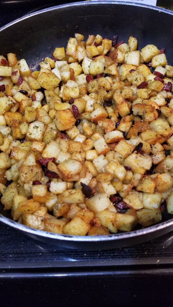Hashed brown potatoes in a skillet