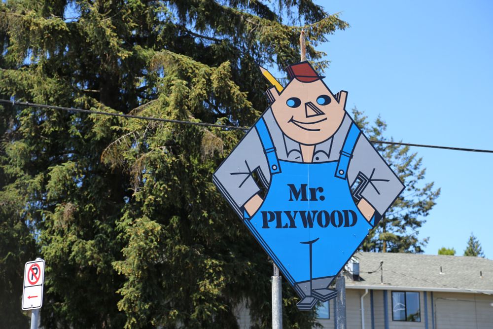 A sign of a terrifying building supplies mascot called "Mr Plywood"