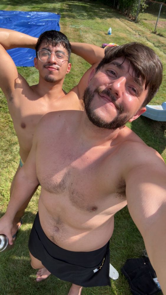 Boyfriend and I shirtless with speedos and an apron on