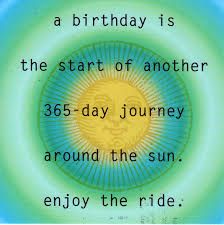 A yellow sun face is in the center of concentric ombre circles turquoise, green, pale green, light blue. Black text over the top says "a birthday is the start of another 365-day journey around the sun. enjoy the ride."