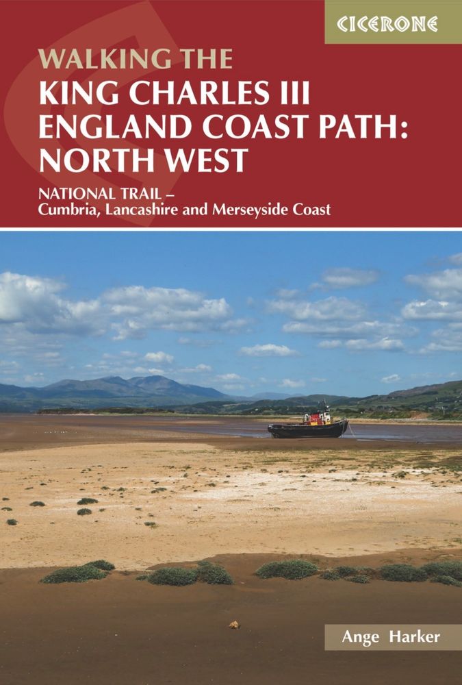 Cover of a walking guidebook named 'Walking the King Charles III England Coast Path: North West', featuring a photo of the Duddon Estuary's sands, a houseboat on the shore, and the Lake District mountains in the distance, under fluffy clouds in a blue sky.