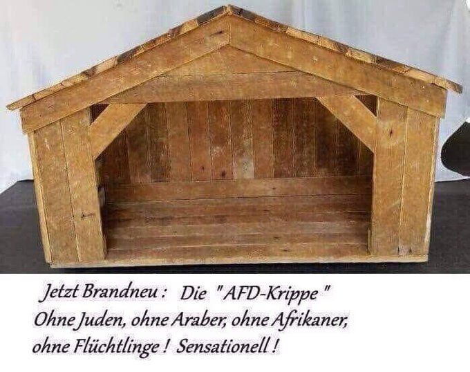 Das Bild zeigt eine leere hölzerne Krippe. Darunter ist der Text zu lesen:
"Jetzt brandneu: Die AfD-Krippe. Ohne Juden, ohne Araber, ohne Afrikaner, ohne Flüchtlinge! Sensationell!"