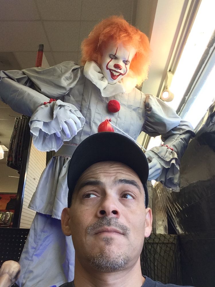 Pennywise the Clown towers menacingly behind Armando Munoz.