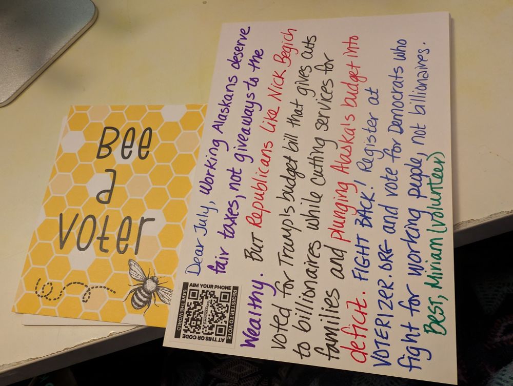 Picture of a postcard with a yellow picture of a bumblebee saying "Bee a Voter" and also the picture of the other side of the card, where I'm writing to people who aren't registered to vote about why its important. 