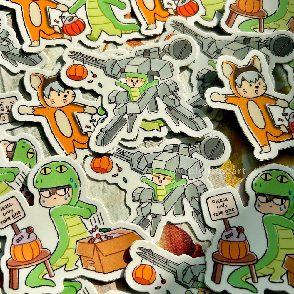 A product photo of a pile of my Metal Gear Solid Halloween stickers. Featured are stickers of chibi Liquid Snake riding a mini Metal Gear Rex, chibi Solid Snake sneaking candy in his box, and Gray Fox and Snake trick-or-treating together.