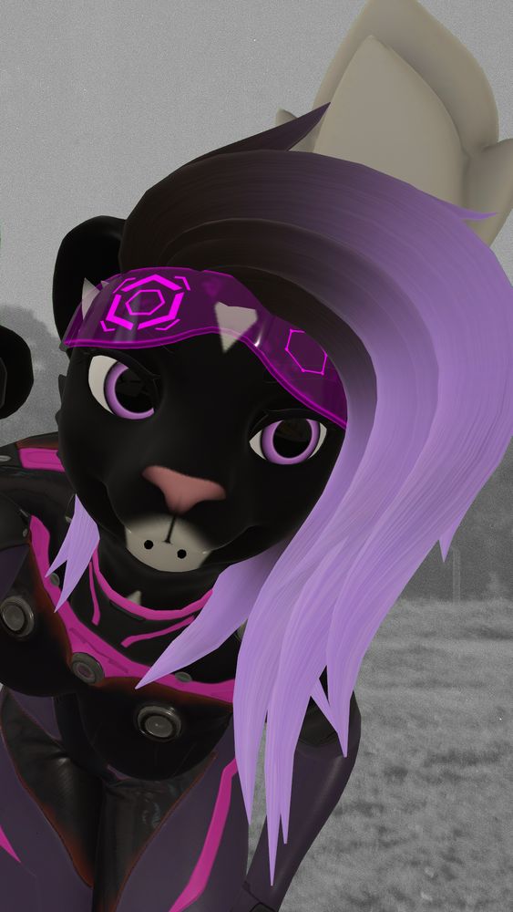 A photo of me leaning forward lifting my RCGs to look at the viewer, bent over forwards. The background is a photo taken by Miyu