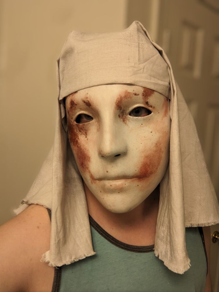 Selfie of me wearing White Mask Varré's mask with a light gray hood over it