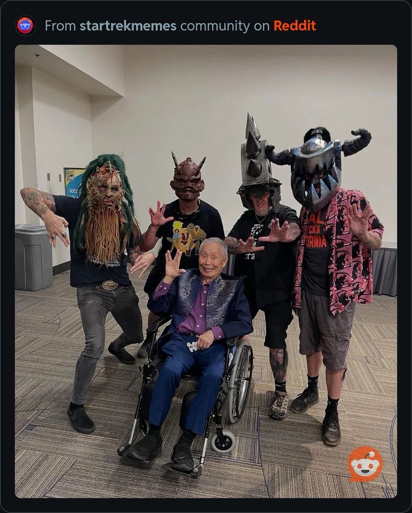 Members of GWAR posing with George Takei.