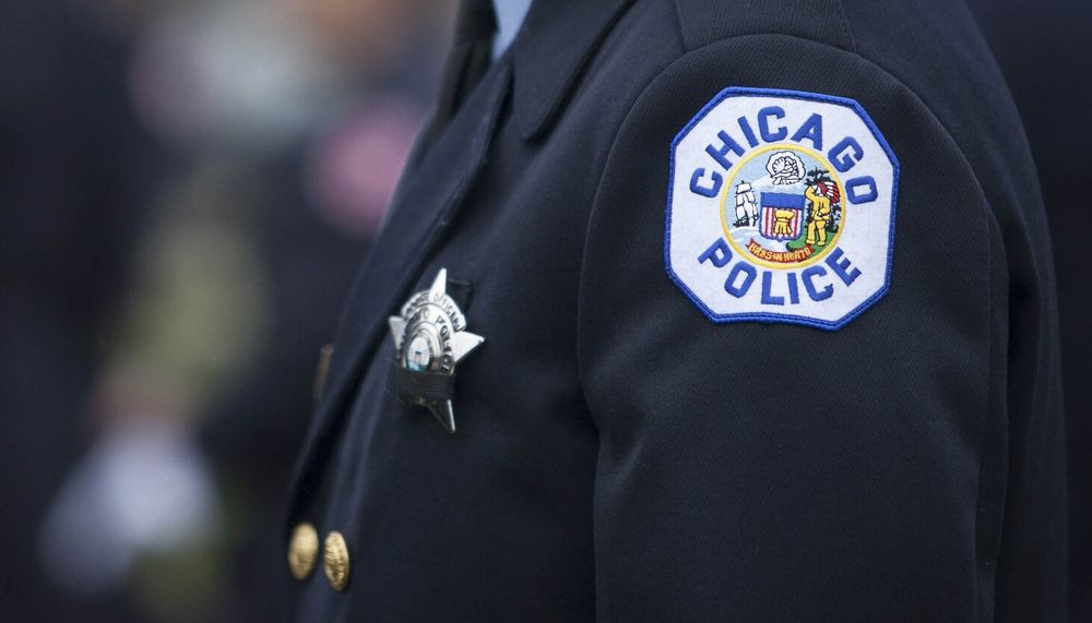 Officer Anthony Banks was also sent a racist cartoon to his department-issued cellphone and was told to "go back where you came from," his lawsuit alleges.