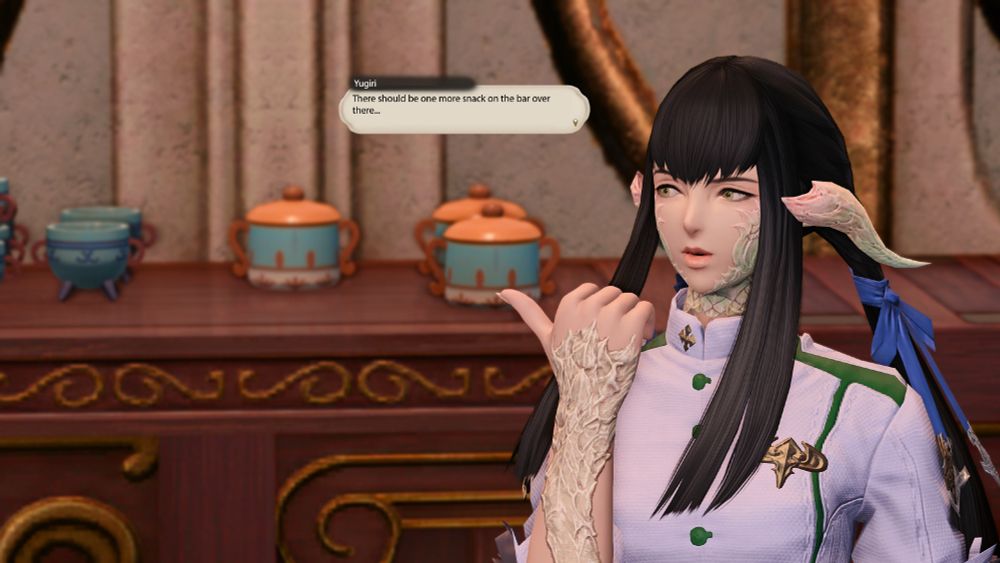 A closer shot of Yugiri.  She looks over her shoulder and jabs her right thumb off to the side.  She says "There should be one more snack on the bar over there"