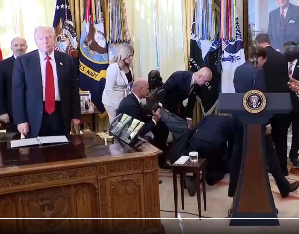 Trump standing by with an irritated and bored look on his face while one of his staffers might be dying in the background.