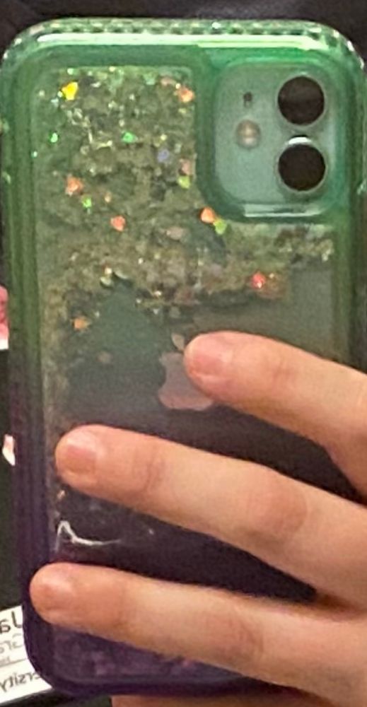Waterfall glitter phone case with teal at the top and purple at the bottom, taken in the mirror mirror selfie style
