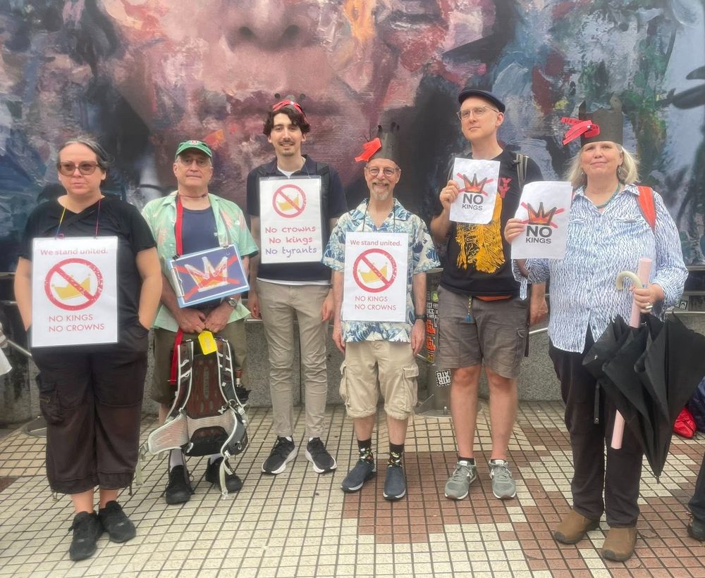 The photo shows a group of American citizens participating in a "No Kings" protest in Tokyo, JUne 14, 2025.