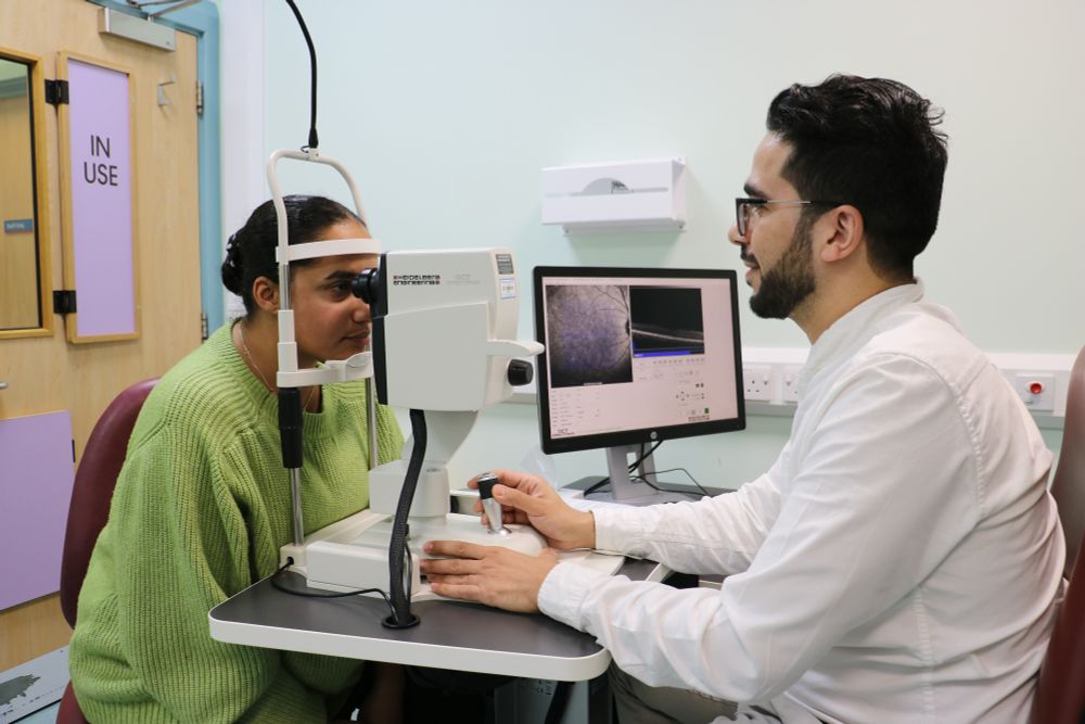 Clinician takes OCT image of person's eye