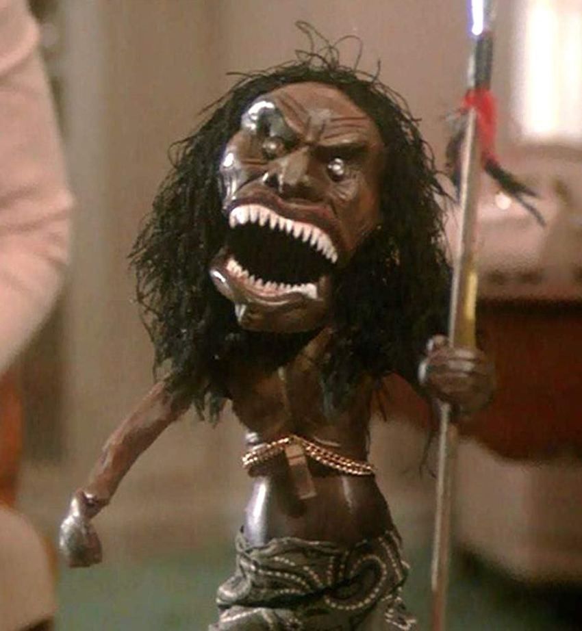 photo of the possessed Zuni doll that came to life and hunted down Karen Black's character in the final episode of the made-for-tv movie "Trilogy of Terror". it is a doll carved of wood with ferocious fanged teeth and carrying a spear. 