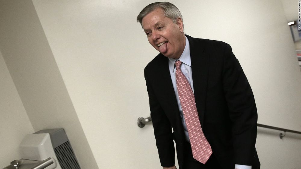 picture of what looks like amens room with lindsey graham standing in the corner with his tongue hanging out.