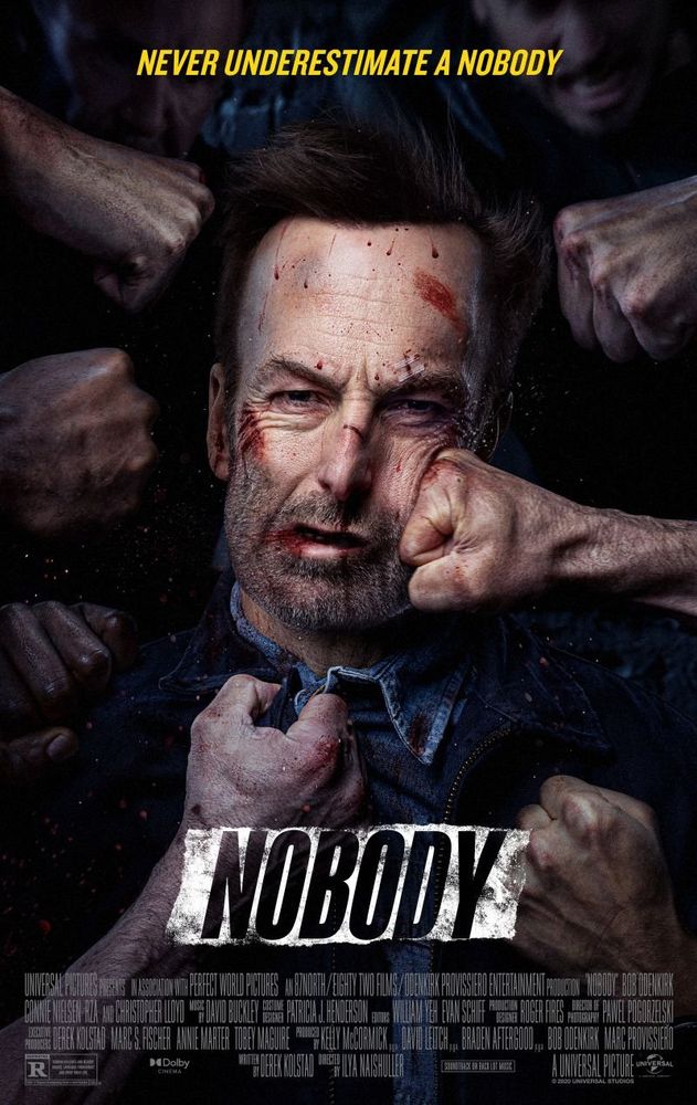 Poster for the film Nobody, featuring actor Bob Odenkirk getting punched in the face by multiple fists.