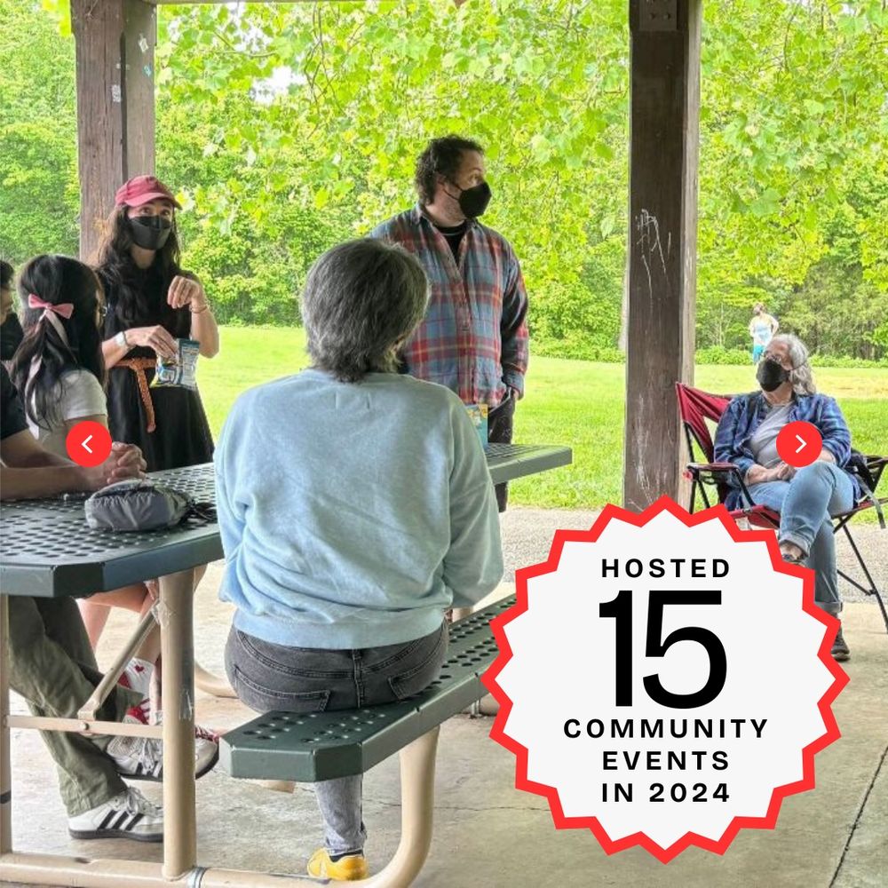 Photo of masked people talking at a park