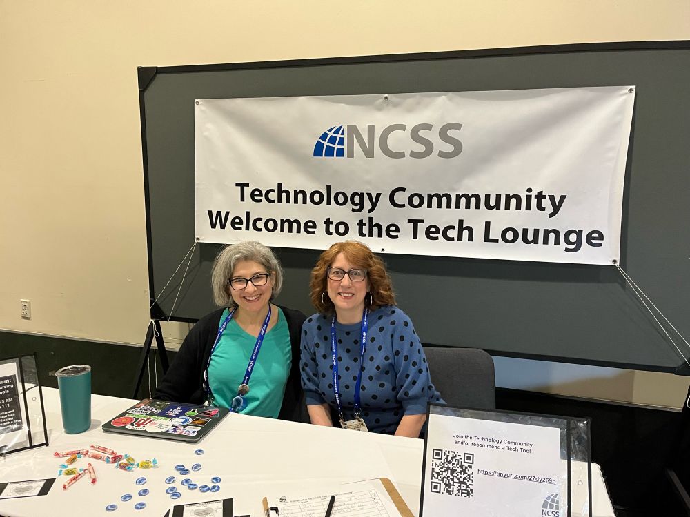 Two tech community members at the Lounge booth