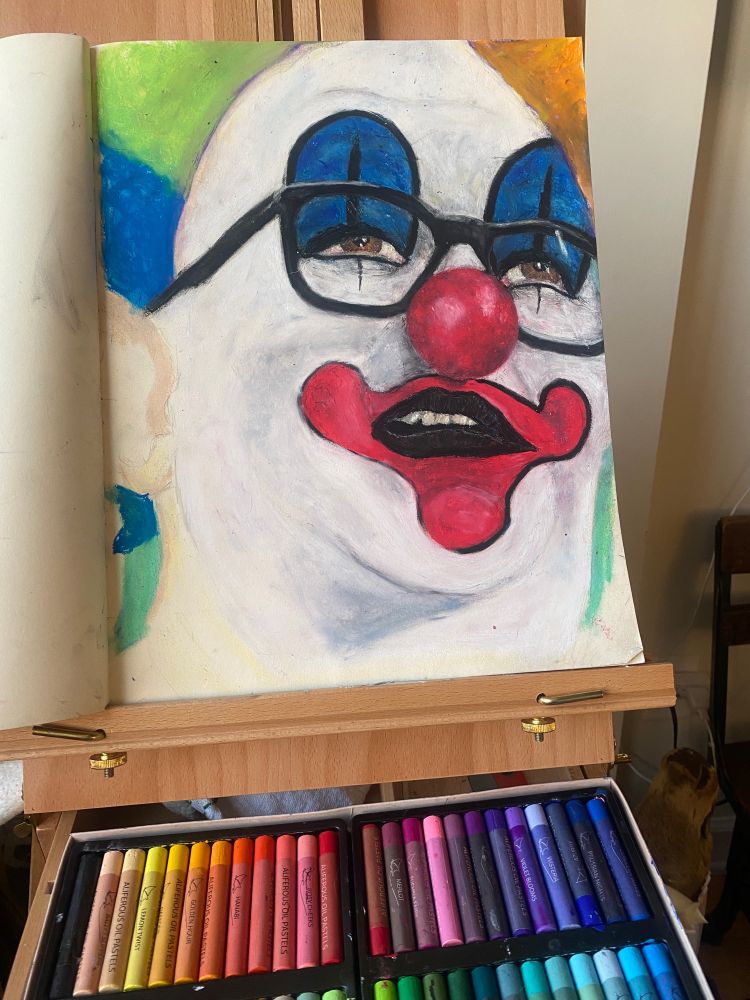 Oil pastel drawing of a clown on an easel 