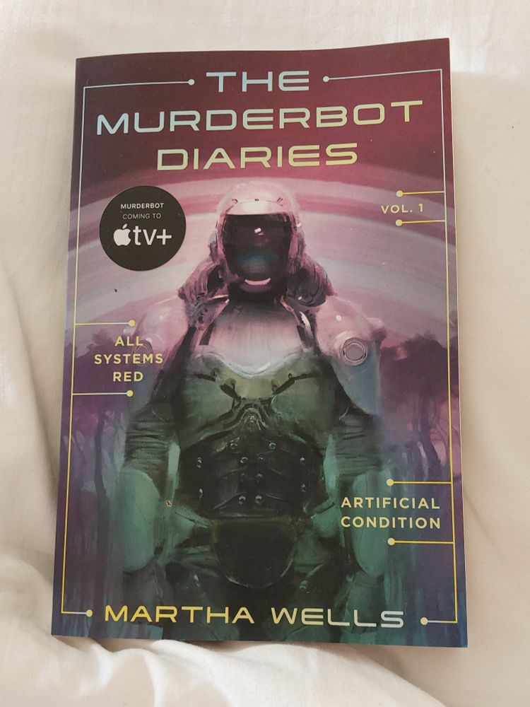 A brand new copy of The Murderbot Diaries: Vol. 1: Artificial Condition by Martha Wells. From the picture you can infer that I'm tucked in bed under nice fresh sheets...