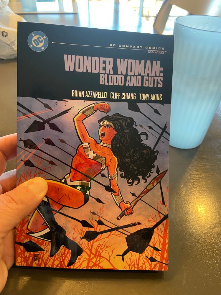 Wonder Woman fighting off arrows. “Wonder Woman: Blood and Guts” DC compact edition. 