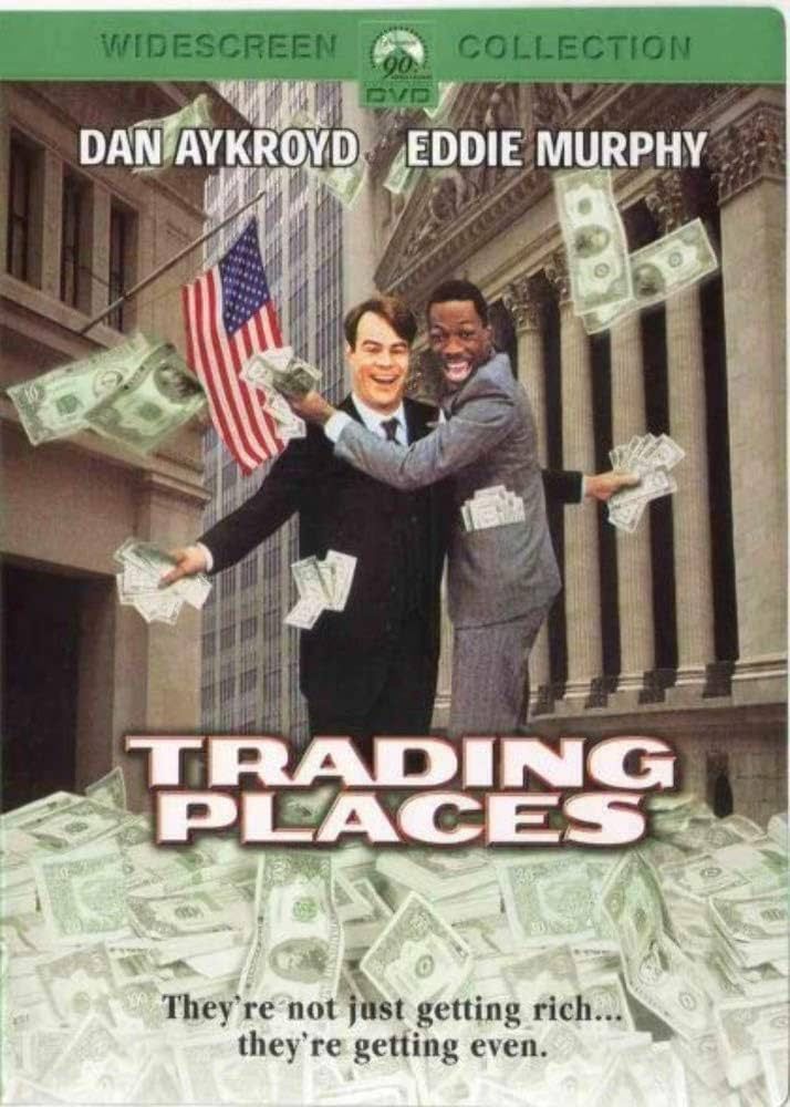 Trading Places movie poster with Dan Ackroyd and Eddie Murphy surrounded by money. 