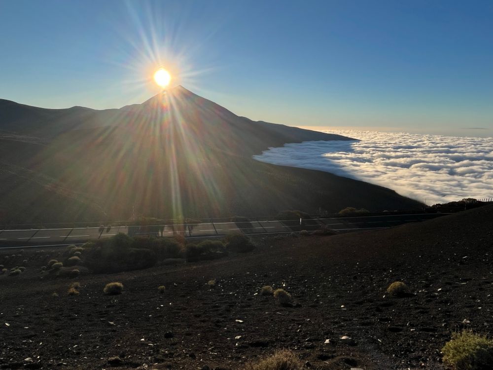 Volcano and clouds below