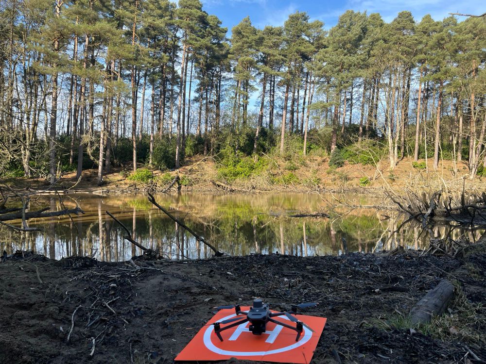 A UAV on the landing pad by a beaver lake