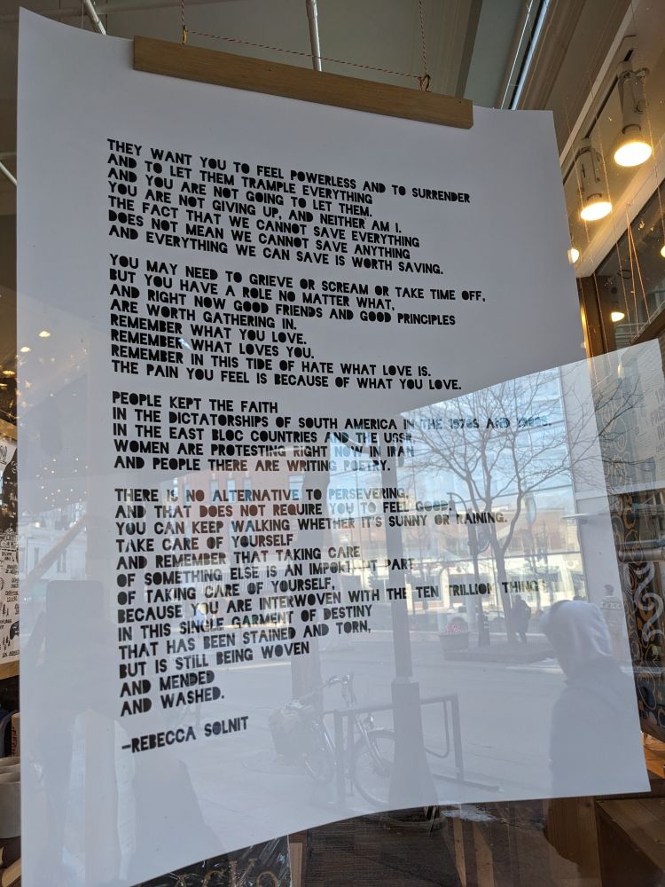 Poster of text by Rebecca Solnit: "They want you to feel powerless and to surrender and to let them trample everything and you are not going to let them. You are not giving up and neither am I."