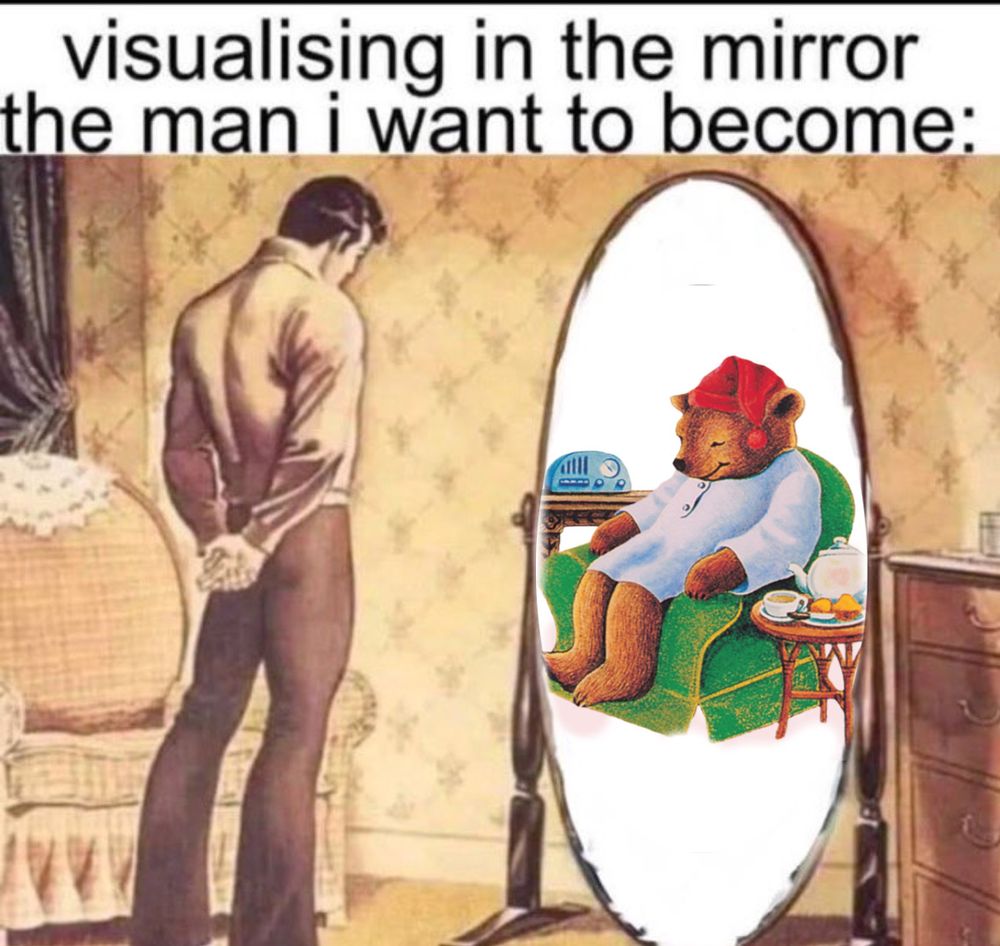 visualizing in the mirror the man I want to become. man staring at a mirror with Sleepytime Bear in it