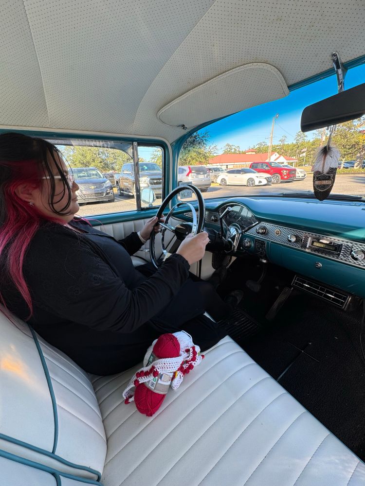My wife in the driver seat of a 55 Chevy Bel Air