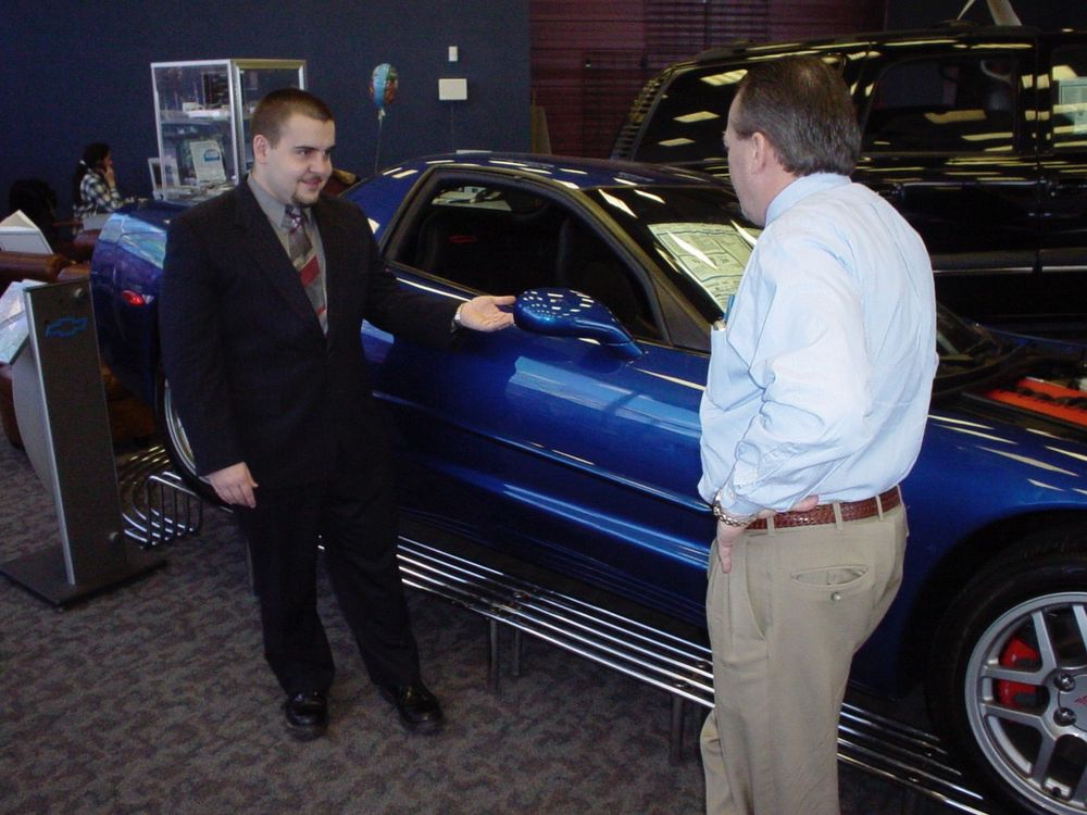 Getting this thing onto that metal stand in the showroom is maybe one of the most bizarre challenges of my life and to this day I'm puzzled how I was chosen for the task. Z06 Corvette, rear wheel drive six speed, and I had to back it up a fairly slick metal stand without falling off. terrifying, but i got it done. This isn't me in the picture, I was also the only guy there with a digital camera. I had forgotten about that day and was searching my photo library for a totally different 2004 picture of another blue car, my prized possession at that time in a 2003 VW GTI. And teaching your girlfriend to drive stick can be a fun way to get dumped, but finding out at the bar that your girlfriend can't drive stick when you thought she was the DD is a less fun way to get dumped. 