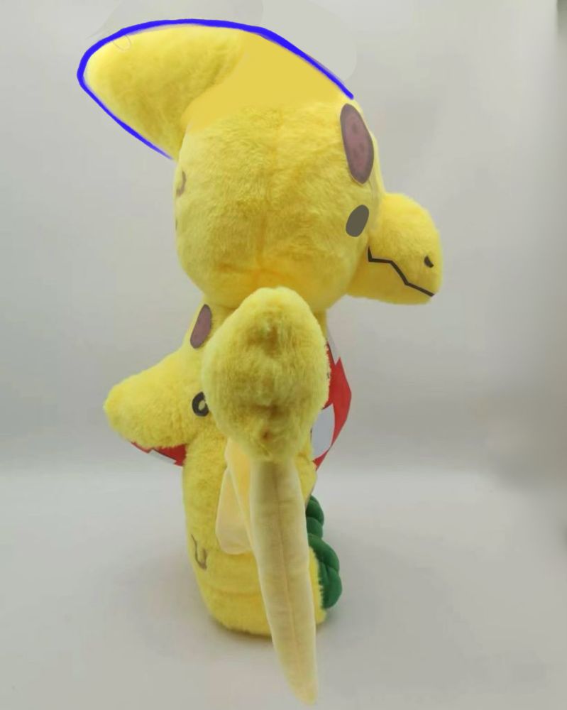 Photo of Rawrcade plush series Pete the pizza pteranodon plushie, facing the side. With minor digitally drawn corrections 