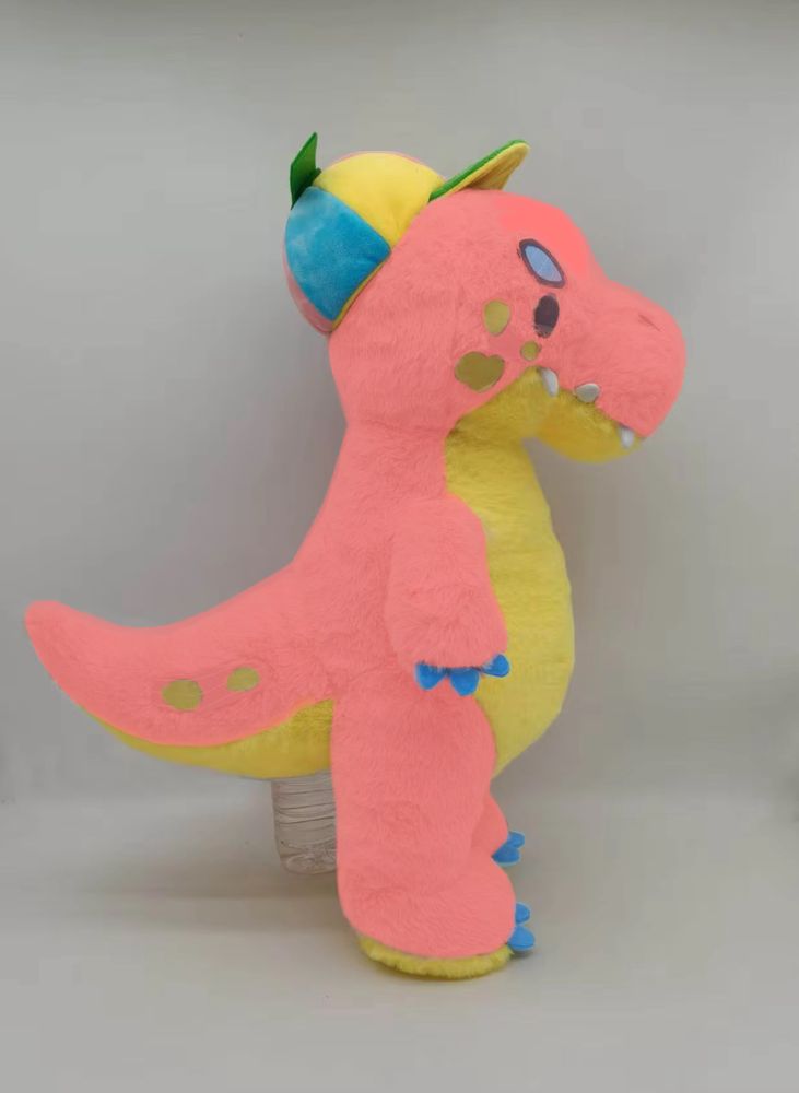Photo of a T Rex plushie, Timmy from Rawrcade. His colors have been altered 