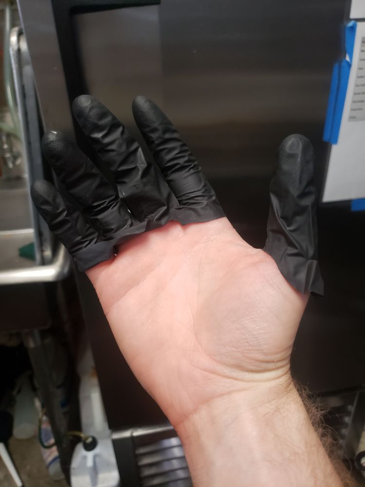 my hand with just the fingers of a rubber glove on