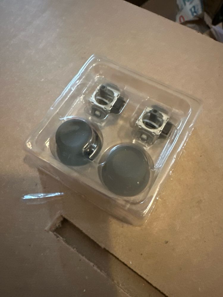 GuliKit TMR Joysticks removed from the box still in packaging. Top row are the joysticks, bottom row are the thumbsticks.