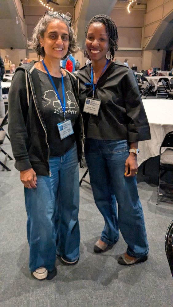 Stacey and I both wearing baggy blue jeans and dark colored shirts.