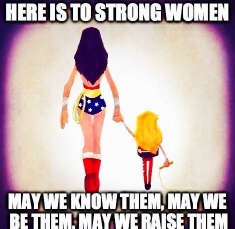 Carbon Wonder Woman leading a young girl with the caption: Here is to strong women. May we know them, may we be them, may we raise them