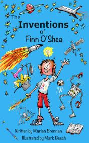 Children’s book by Marian Brennan. Inventions of Finn O’Shea. Blue cover. Child in red shorts, white t-shirt surrounded by inventions. 