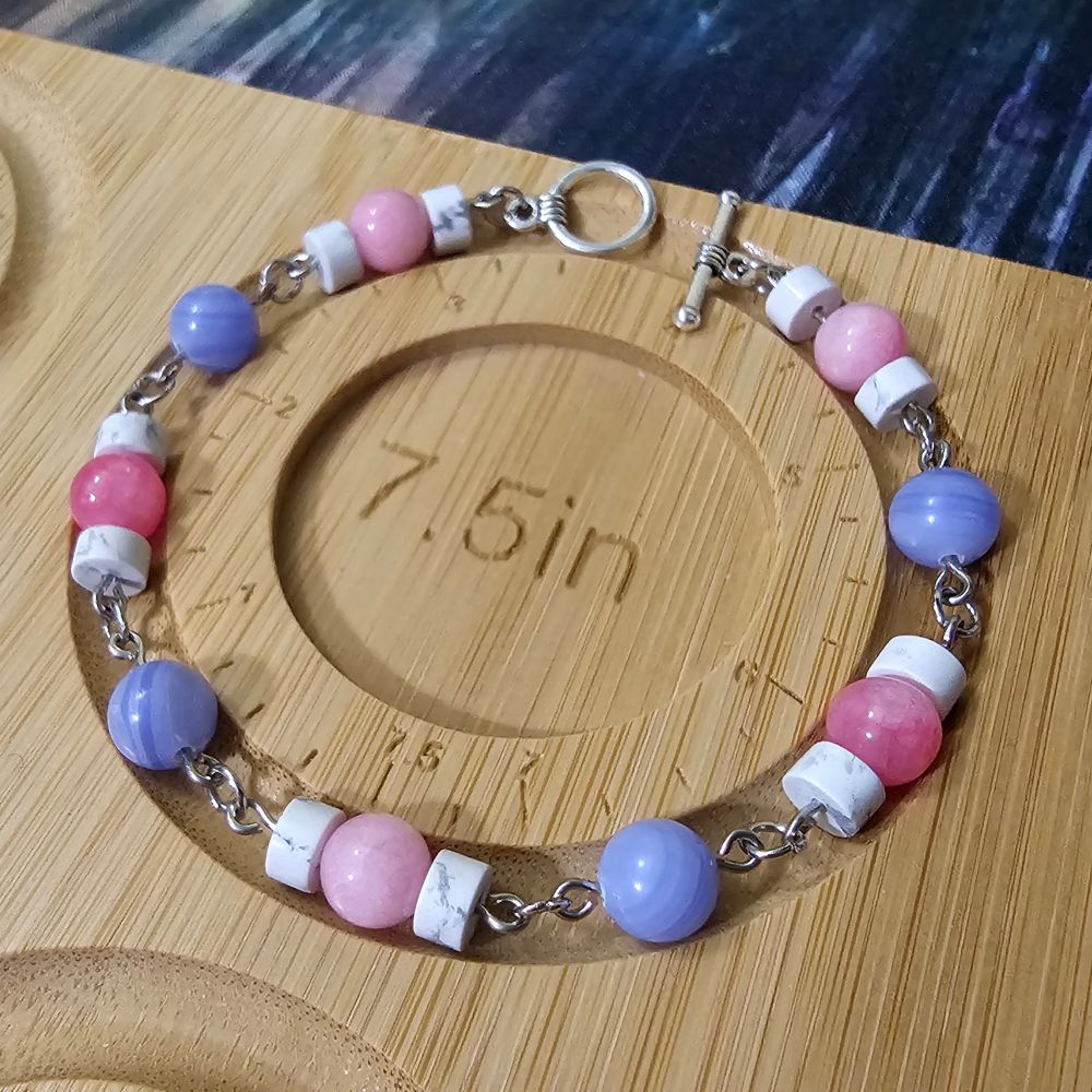 A trans coloured design using pink opal jade, blue lace agate and white howlite.